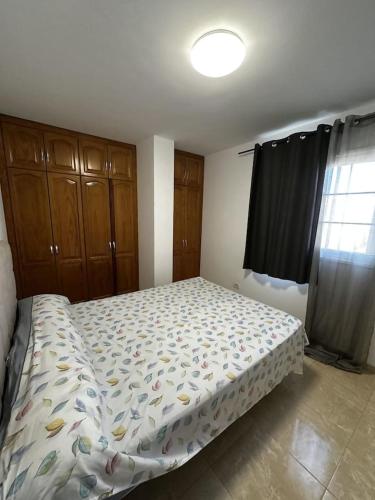 Postel nebo postele na pokoji v ubytování Appartamento 2 camere da letto Buzanada Tenerife