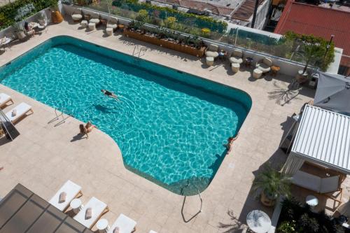 an overhead view of a swimming pool with people in it at Intercontinental Real Guatemala by IHG in Guatemala