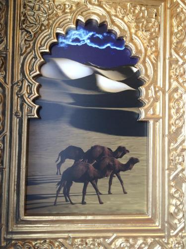 a painting of four horses running in a field at Gardaland Adventure Hotel in Castelnuovo del Garda