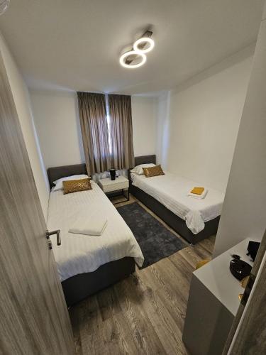 a hotel room with two beds and a window at LaNiMa LUX in Žminj