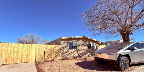 a car parked in front of a house with a fence at Page Lake House,Freshly Remodeled,Central, Boat Parking in Page