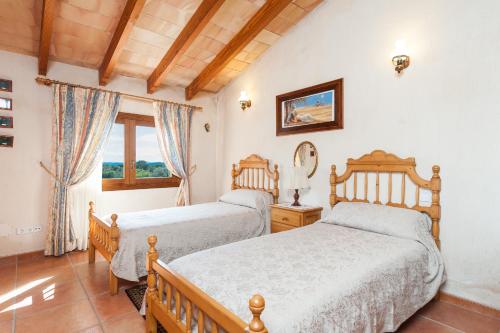Säng eller sängar i ett rum på CANTABOU SA COMA D'INCA