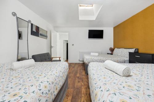 Postel nebo postele na pokoji v ubytování Rusholme Rooms