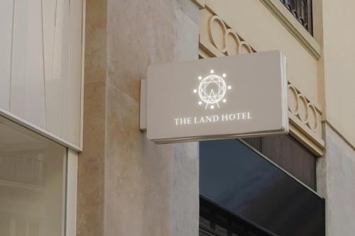 a sign for the land hotel on the side of a building at THE LAND HOTEL - Vacation STAY 15680v in Arao