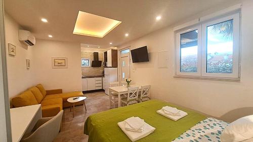 Kuchyň nebo kuchyňský kout v ubytování Apartments Martina Studio