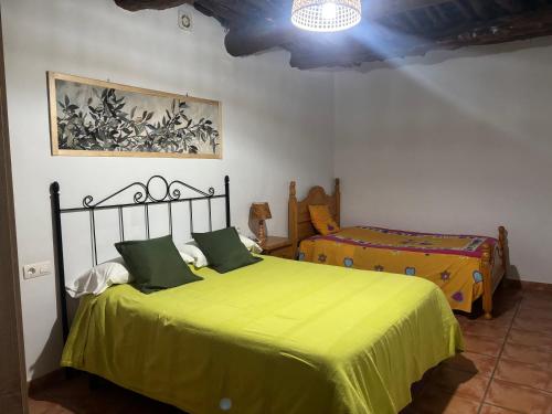 Ένα ή περισσότερα κρεβάτια σε δωμάτιο στο CASA M'GUIRE
