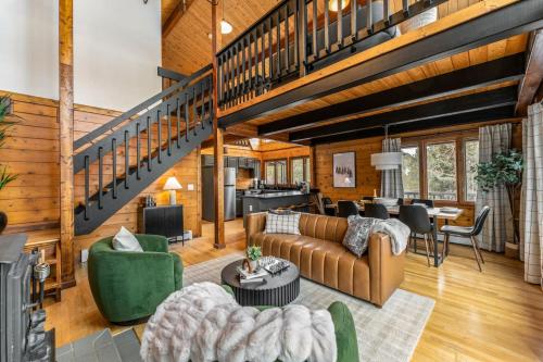 a living room filled with furniture and a staircase at The Aspen Ridge Stargazer in Cripple Creek