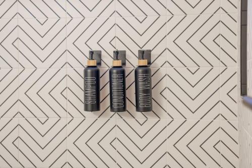 three black bottles on a chevron wall at The Aspen Ridge Stargazer in Cripple Creek