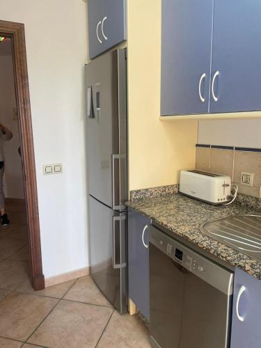 Η κουζίνα ή μικρή κουζίνα στο FRONTAL EN JARDINES DE ZAHARA 3 Dorm y 2 Baños
