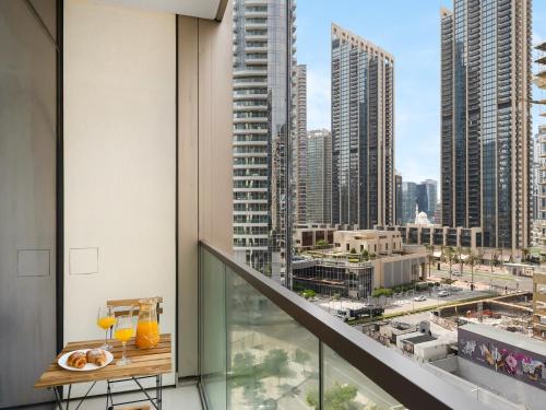 a balcony with a view of a city at Elegant 1BR I 1min walk to Burj Khalifa & Fountain in Dubai