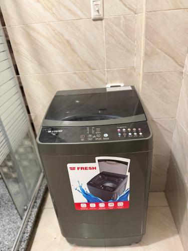 a trash can with a phone on top of it at JRE-EG modern aprt01SheikhZayed 5min to ArkanPlaza in Sheikh Zayed