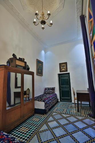 Postel nebo postele na pokoji v ubytování Dar Usham Fes