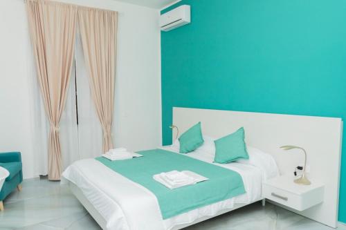 Katil atau katil-katil dalam bilik di Armonia Salerno Rooms