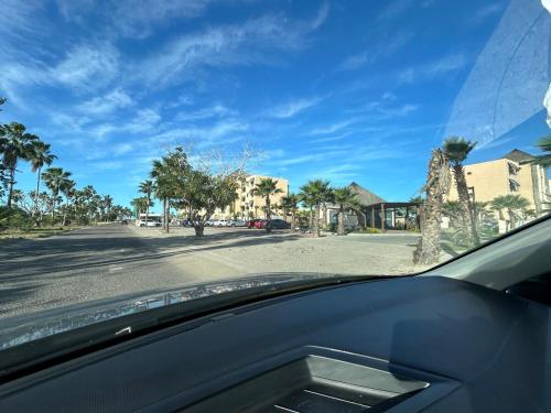 a view of a street from the dashboard of a car at Punta Paraiso Departamento in Isla de Redo