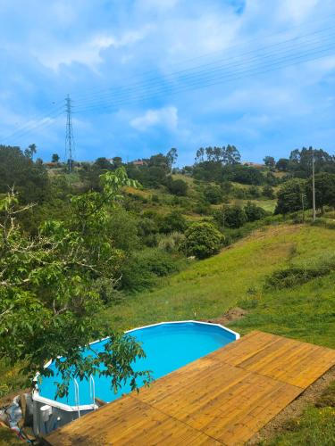 a view of a swimming pool from the roof of a house at Quinta da Casa Azul in Óbidos