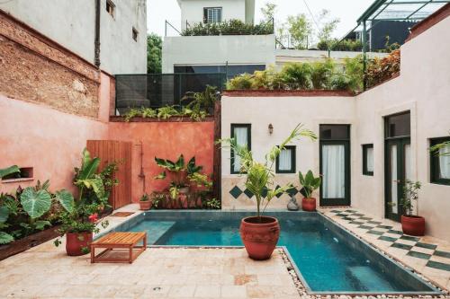 an apartment with a swimming pool in a building at Casa Grullon, an Oasis in the Colonial Zone in Santo Domingo