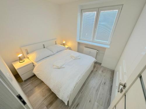 Postel nebo postele na pokoji v ubytování Krásny byt - apartmán v Novom meste