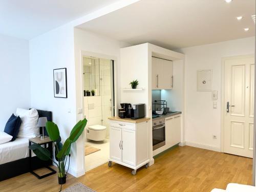 Nhà bếp/bếp nhỏ tại bella casa - Business&Family, 100m zum Konzerteingang Schloß, Parkplatz, SmartTV, Netflix, Waschmaschine,24h Checkin, 30qm, AP 5