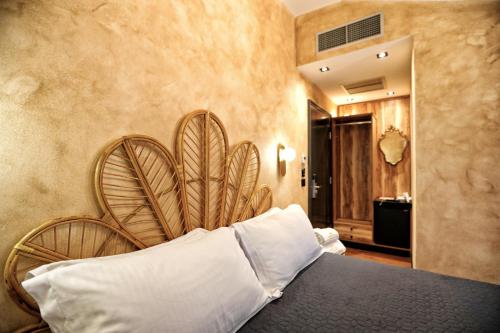 Ein Bett oder Betten in einem Zimmer der Unterkunft Hotel Labiatan