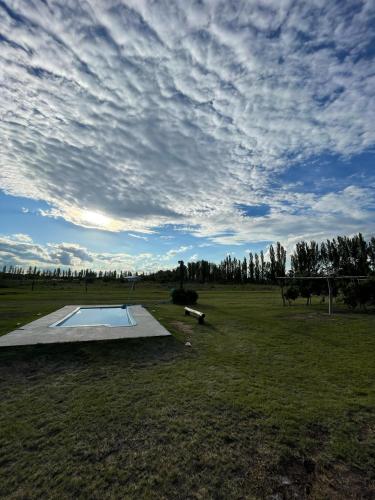 a skate park with a pool in the middle of a field at Las Potrancas cabaña in General Alvear
