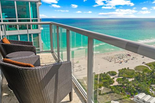 a balcony with a view of a beach and the ocean at Oceanview Private Condo at The Setai -3504 in Miami Beach