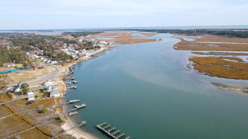 an aerial view of a river with a beach at Moon Rising - Waterfront with shared dock! in Black Point Landing