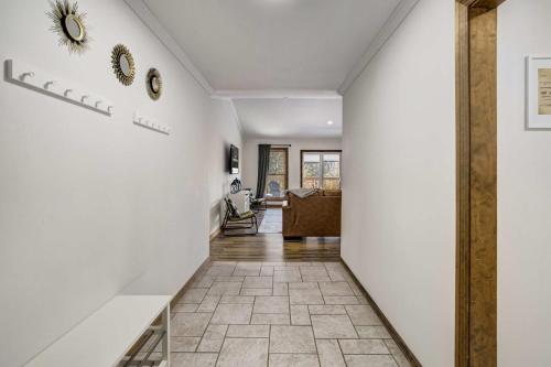 a hallway of a home with white walls at Rustic Outlaw Secluded Escape with Stunning Views in Cripple Creek