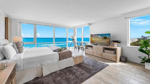 a bedroom with a large bed and a view of the ocean at Oceanview Private Condo at 1 Hotel & Homes -1120 in Miami Beach