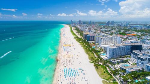 an aerial view of a beach and the ocean at Oceanview Private Condo at 1 Hotel & Homes -1120 in Miami Beach