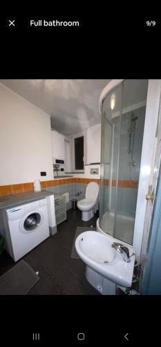 a bathroom with two toilets and a sink and a shower at City Center Heart in Turin
