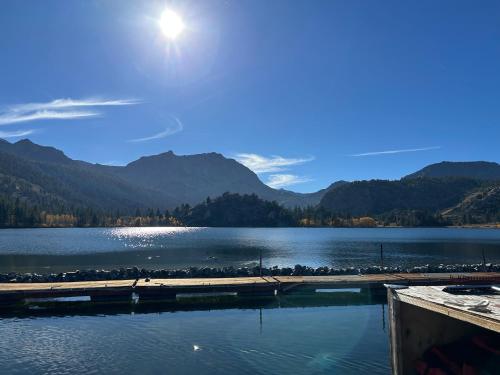 a view of a lake with mountains in the background at Whispering Pines in June Lake