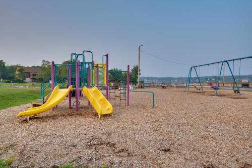 a playground with a slide in a park at 7 Mi to Big Boulder Mtn Poconos Chalet with Hot Tub in Albrightsville
