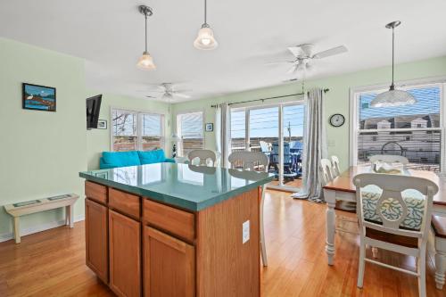 a kitchen and dining room with a table and chairs at Olive Ponies - Upper level with water Views! in Birch Town
