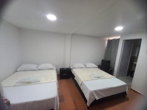 Кровать или кровати в номере Habitaciones Amobladas VILLA DEL RIO, cerca del Hospital