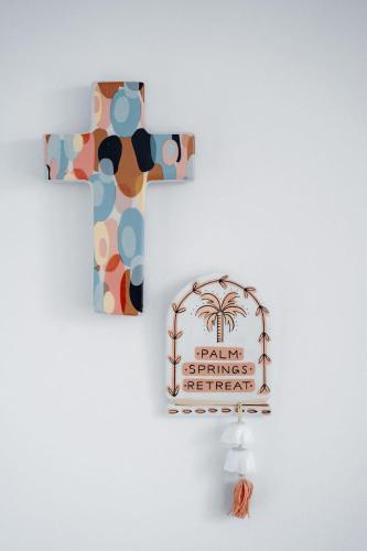 a wooden cross with a sign on a wall at Palm Springs Retreat in The Range