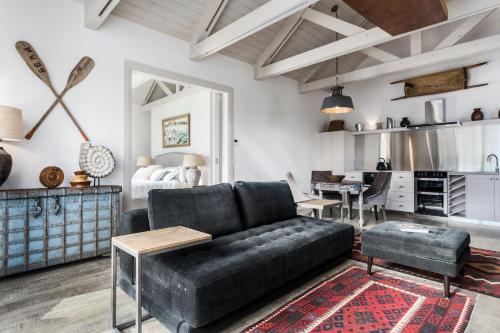 a living room with a couch and a table at The BoatHouse in Dover