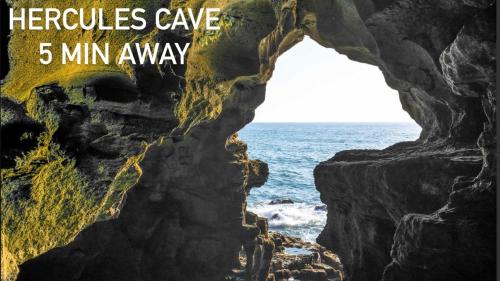 a cave over the ocean with the words frequencies cave min away at CALAYS Tu hogar junto al mar - ideal CAN2025 in Tangier
