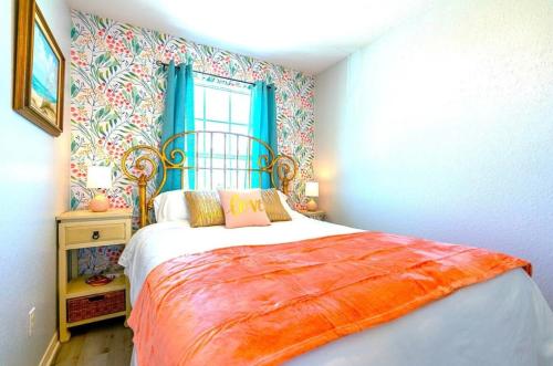 a bedroom with a bed and a window at Starfish Beachfront Swim-Up in Surfside Beach