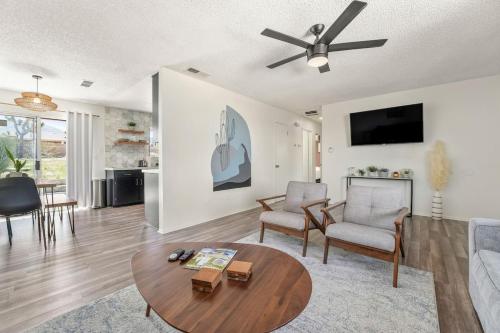 a living room with a couch and a table at Grand Desert Oasis - SPA - A Location - JT Park in Joshua Tree
