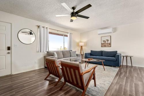 a living room with a couch and a table at Grand Desert Oasis - SPA - A Location - JT Park in Joshua Tree