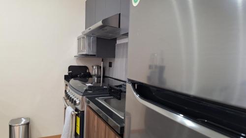 Kuchyň nebo kuchyňský kout v ubytování Departamento Nuevo y Moderno Totalmente Equipado