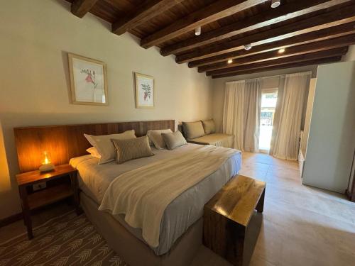 a bedroom with a large bed in a room at Casa Haydee in Ciudad Lujan de Cuyo