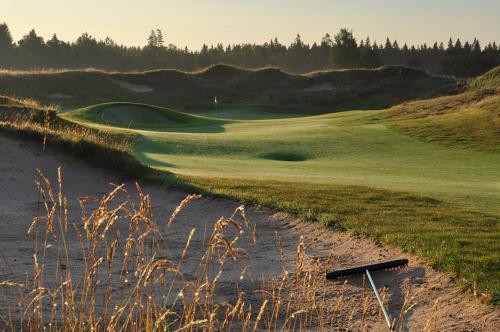 a view of a golf course with a sand duneramid at Sand Golf Club in Bankeryd