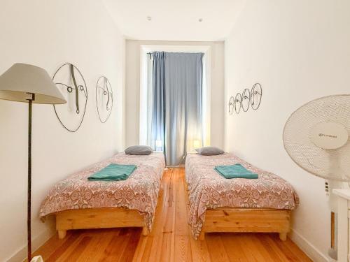 En eller flere senge i et værelse på Home Sonhos Fanqueiros