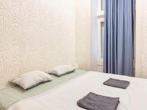 En eller flere senge i et værelse på Home Sonhos Fanqueiros