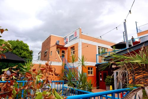 a building with plants in front of it at City Backpackers HQ in Brisbane