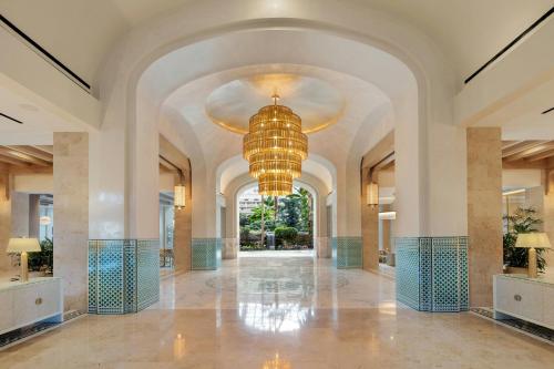 a large hallway with a chandelier in a building at Gaylord Palms Resort & Convention Center in Orlando