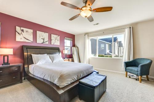 a bedroom with a bed and a ceiling fan at Spacious Kent Home Near SeaTac Airport with Patio in Kent