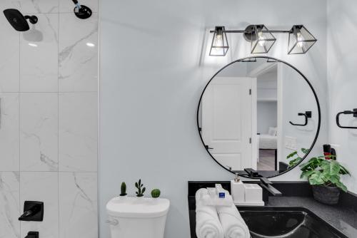a bathroom with a sink and a mirror at You will love this 2BR Guest Suite in SE Calgary in Calgary