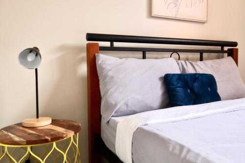 a bedroom with a bed and a side table at City Backpackers HQ in Brisbane